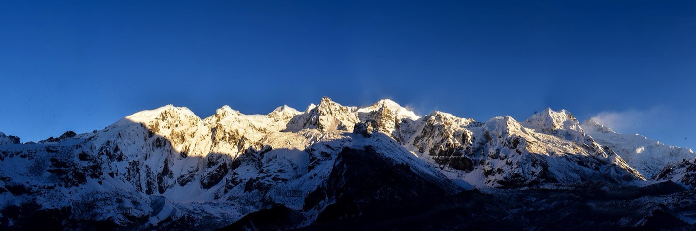 Kanchenjunga range glowing golden at sunrise, visible from Pelling