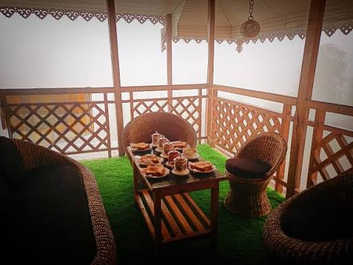Breakfast served in the gazebo with cane chairs