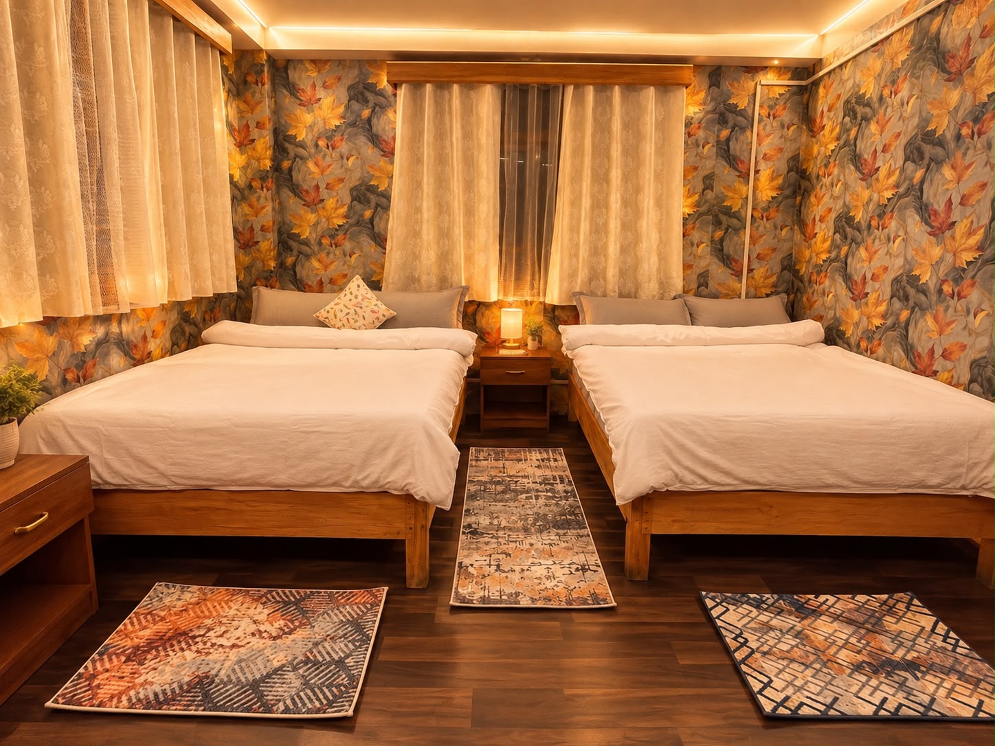 Skywalk Suite — two queen beds with cushions and cream curtains