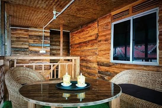 Wooden Room Cedar — log-wood walls with cane seating corner